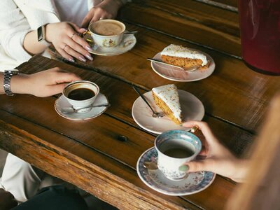 Women sharing coffee & cake - Image by Alexander Andreev