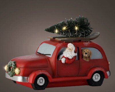 Santa in lit red car - image 1